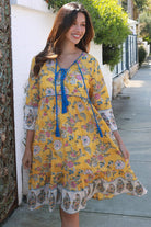 Golden Dahlia cotton boho mini dress wit floral border print blue piping and tassel ties - Australia