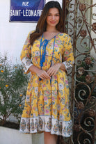 Golden Dahlia cotton boho mini dress wit floral border print blue piping and tassel ties - Australia