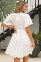 White Embroidery Anglaise mini dress with tiered skirt, scalloped hem and lace-trim sleeves – summer boho style Australia