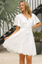 White Embroidery Anglaise mini dress with tiered skirt, scalloped hem and lace-trim sleeves – summer boho style Australia