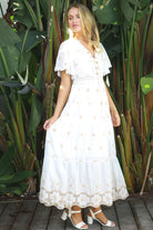 White cotton maxi dress with warm beige embroidery and scalloped embroidered hemline.