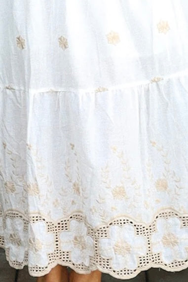 White cotton maxi dress with warm beige embroidery and scalloped embroidered hemline.