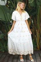 White cotton maxi dress with warm beige embroidery and scalloped embroidered hemline.