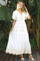 White cotton maxi dress with warm beige embroidery and scalloped embroidered hemline.
