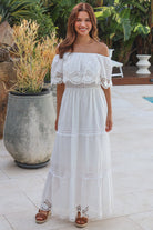 White off shoulder embroidered cotton maxi dress with lace crochet panels and tiered skirt