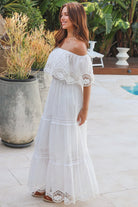 White off shoulder embroidered cotton maxi dress with lace crochet panels and tiered skirt