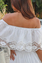 White off shoulder embroidered cotton maxi dress with lace crochet panels and tiered skirt