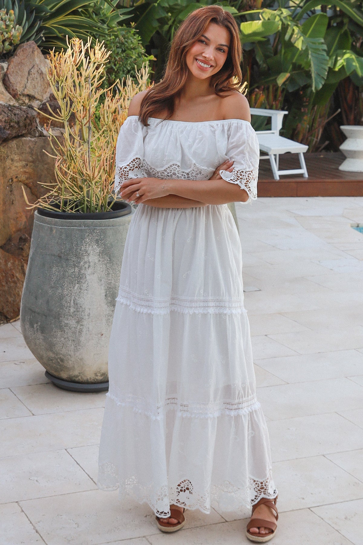White off shoulder embroidered cotton maxi dress with lace crochet panels and tiered skirt