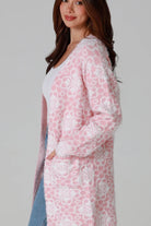 Luxury pink floral longline cardigan brushed knit with front patch pockets Charlotte the Label soft halo texture. Boho Knitwear Australia.