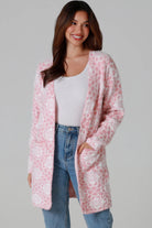 Luxury pink floral longline cardigan brushed knit with front patch pockets Charlotte the Label soft halo texture. Boho Knitwear Australia.