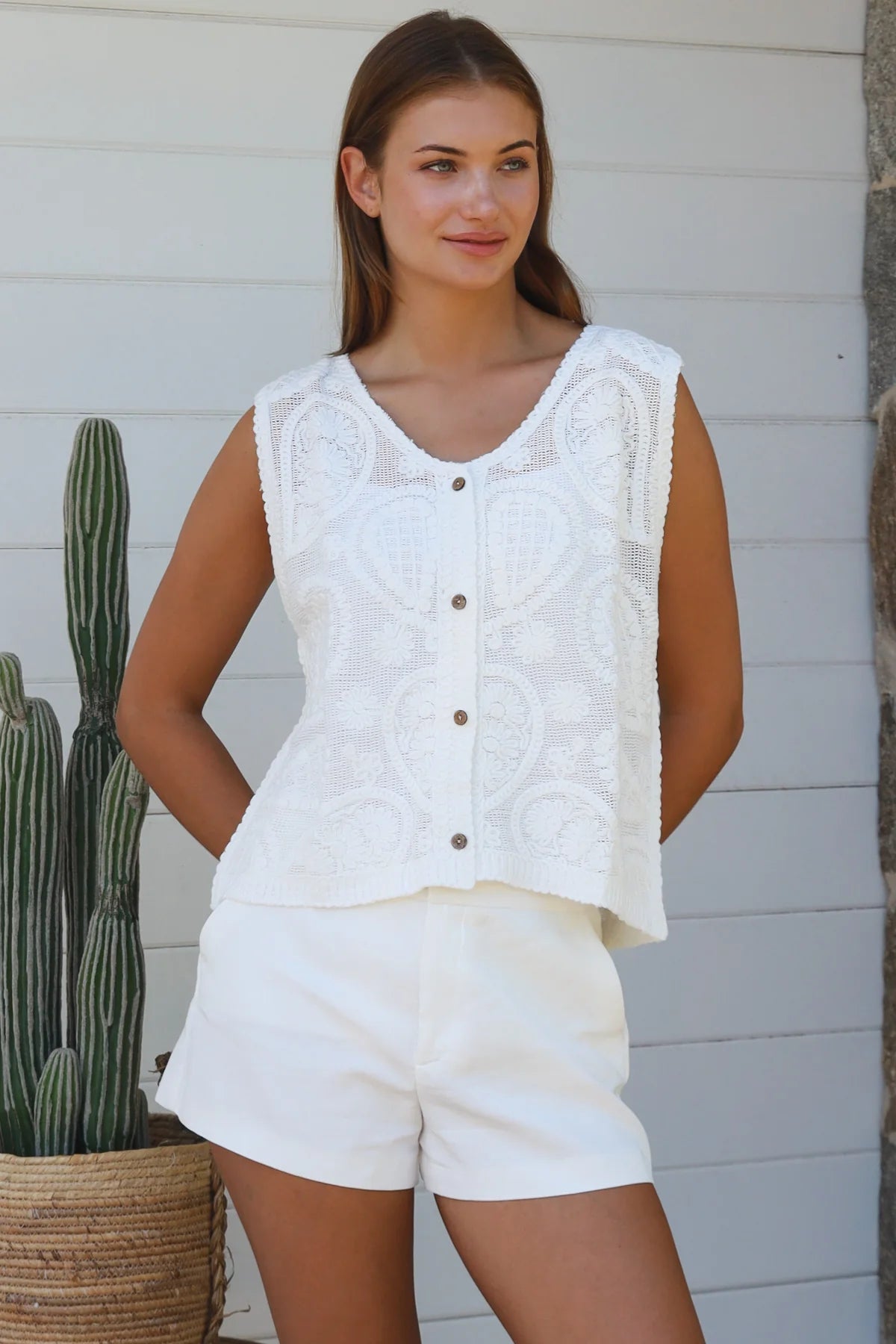 White cotton embroidered sleeveless vest with button front styled for Australian summer boho fashion