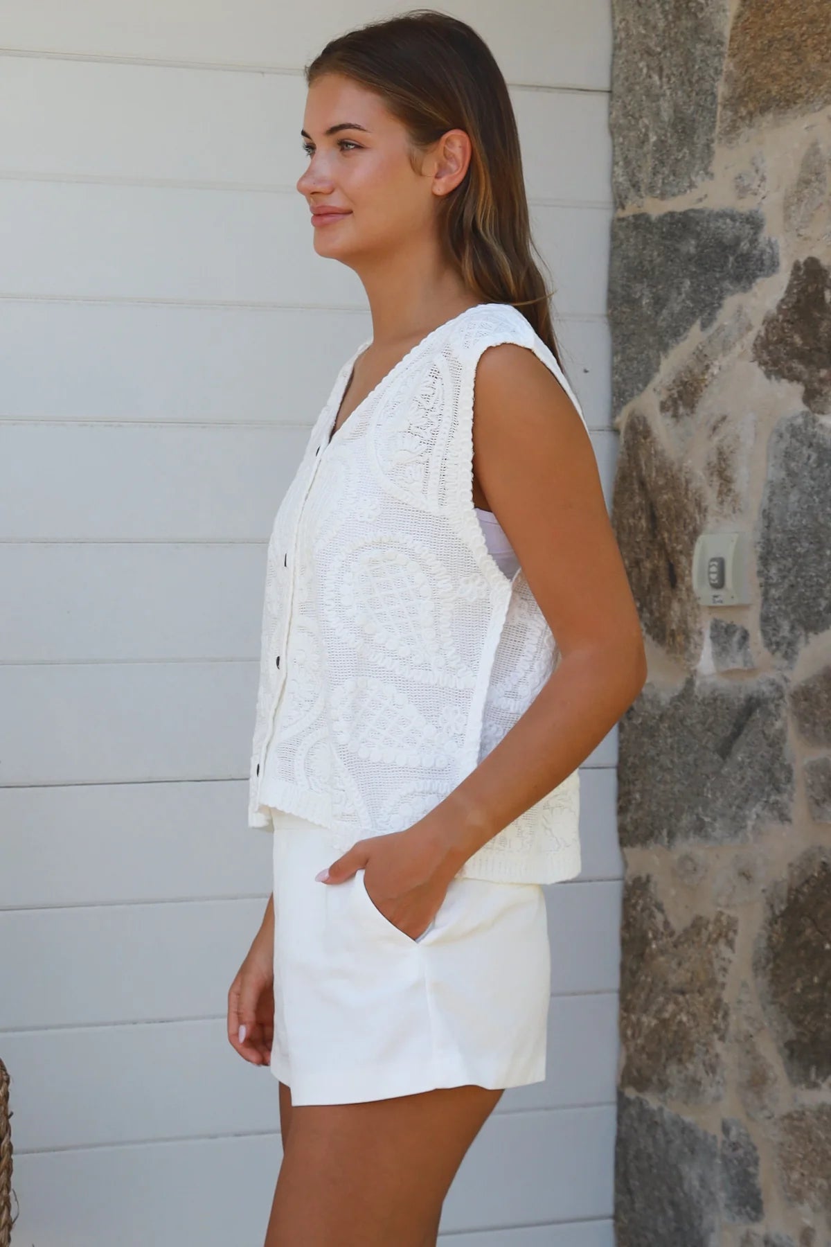 White cotton embroidered sleeveless vest with button front styled for Australian summer boho fashion