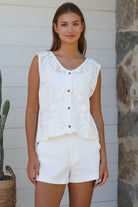 White cotton embroidered sleeveless vest with button front styled for Australian summer boho fashion