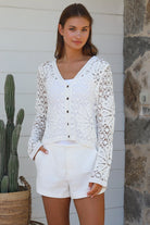 White crochet cardigan with floral blossom pattern soft vegan cotton breathable summer boho wardrobe essential — Willow Label