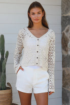 Cream floral crochet cardigan with scalloped sleeves and button-front V-neck styling — boho knitwear Australia