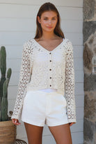 Cream floral crochet cardigan with scalloped sleeves and button-front V-neck styling — boho knitwear Australia