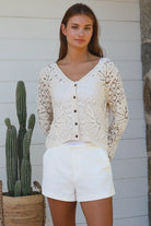 Cream floral crochet cardigan with scalloped sleeves and button-front V-neck styling — boho knitwear Australia