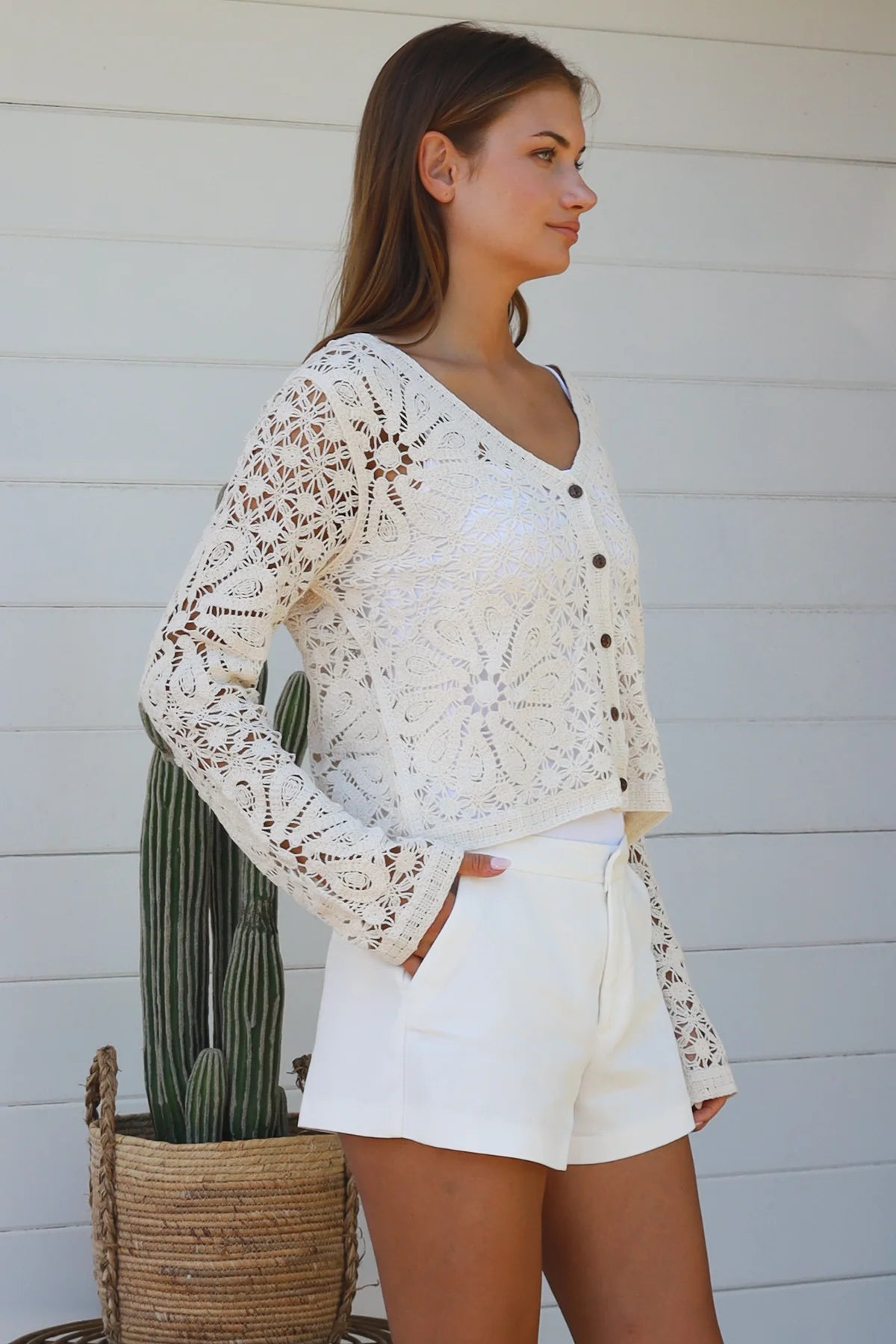 Cream floral crochet cardigan with scalloped sleeves and button-front V-neck styling — boho knitwear Australia