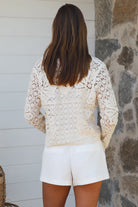 Cream floral crochet cardigan with scalloped sleeves and button-front V-neck styling — boho knitwear Australia