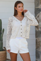 Cream floral crochet cardigan with scalloped sleeves and button-front V-neck styling — boho knitwear Australia