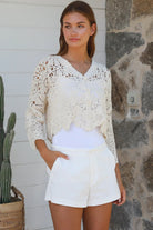 Cream crochet cotton cardigan with scalloped hem and flared sleeves by Willow the Label, women’s boho cardigan