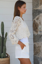 Cream crochet cotton cardigan with scalloped hem and flared sleeves by Willow the Label, women’s boho cardigan