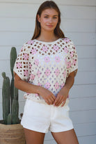 Cream + pink cotton crochet boho top with daisy squares — relaxed summer layering piece Australia.