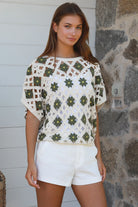 Khaki cotton crochet top with floral detail styled for modern boho elegance — Willow The Label at Bohemian Love Runway