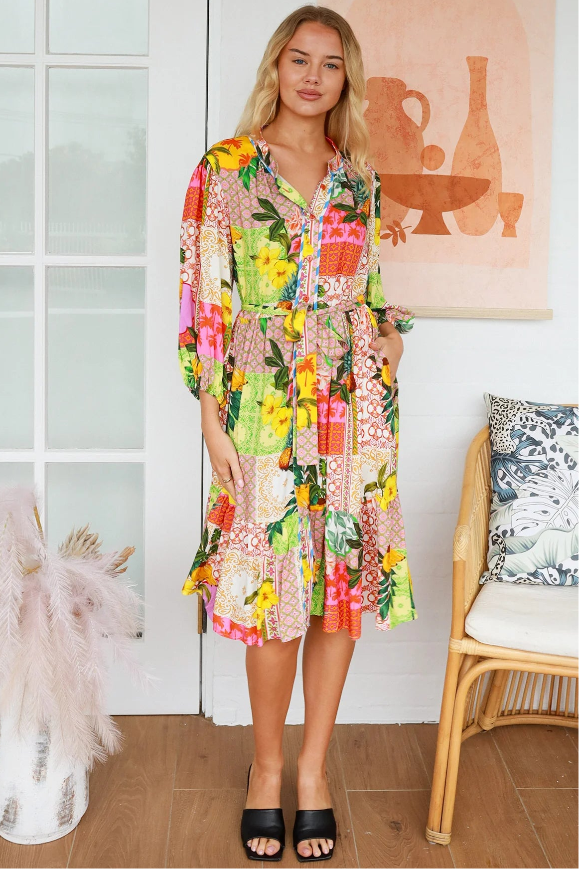“Woman in a tropical bamboo patchwork boho midi dress with mandarin collar and belt – sustainable bohemian clothing Australia”
