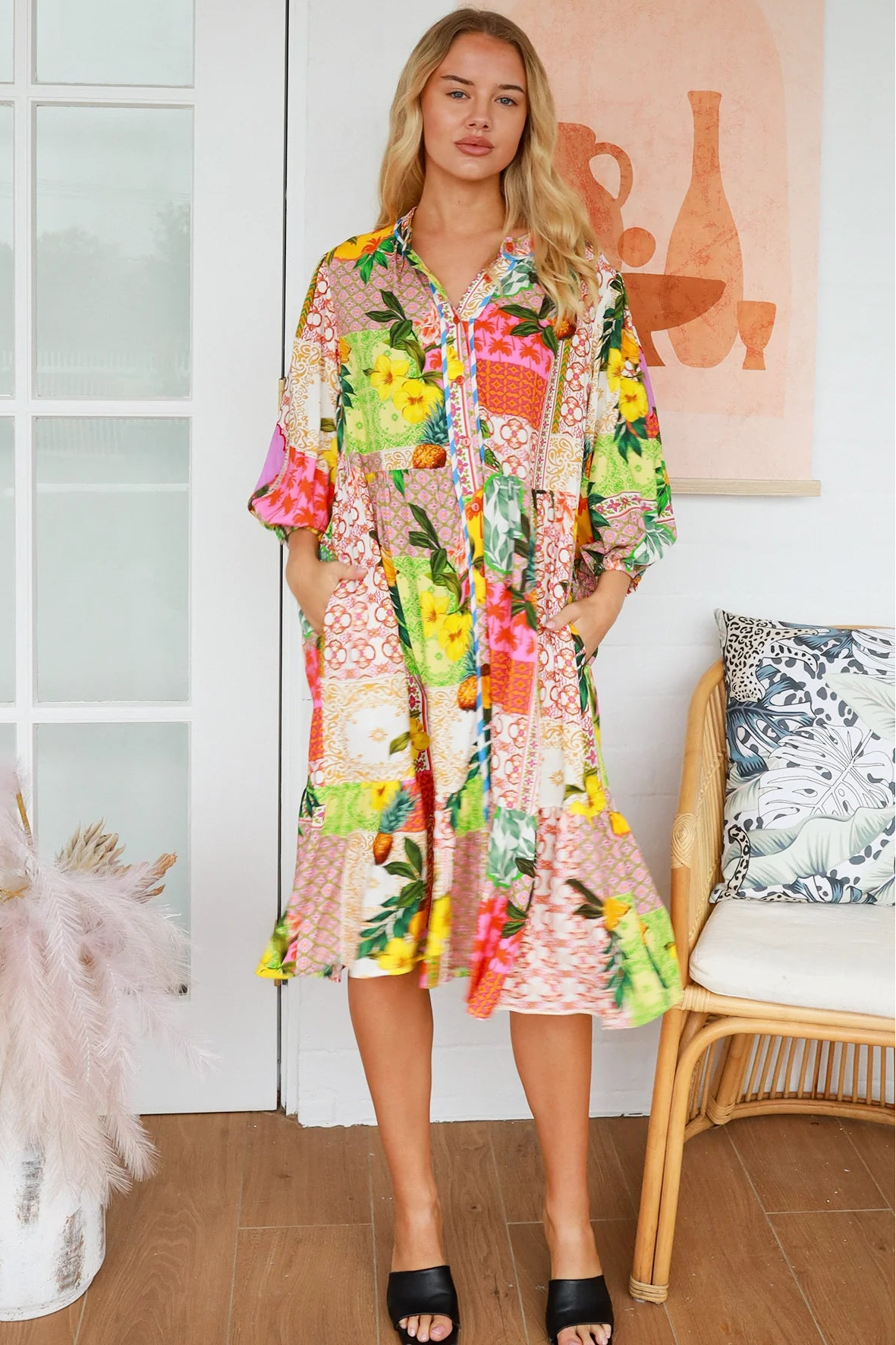 “Woman in a tropical bamboo patchwork boho midi dress with mandarin collar and belt – sustainable bohemian clothing Australia”