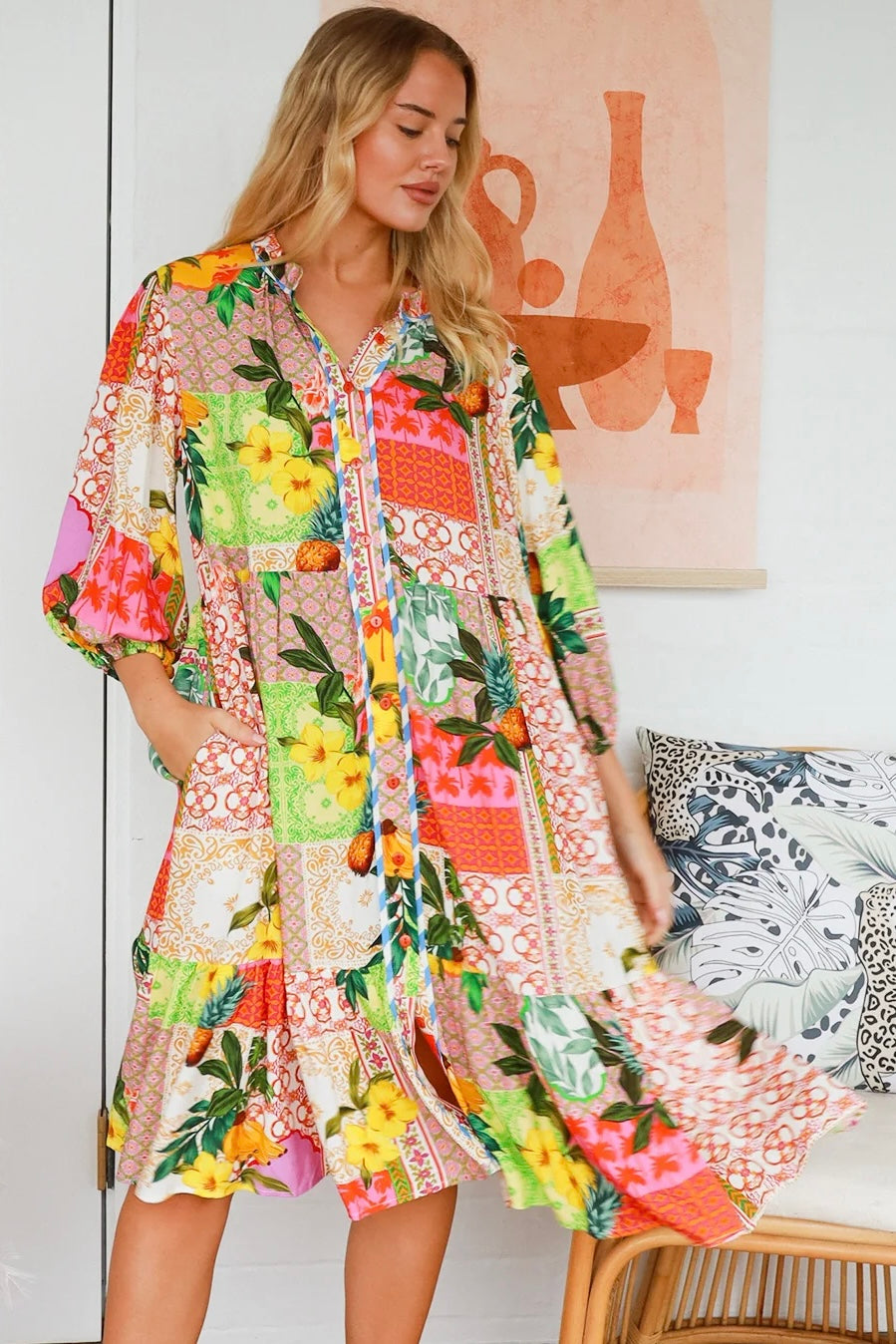 “Woman in a tropical bamboo patchwork boho midi dress with mandarin collar and belt – sustainable bohemian clothing Australia”