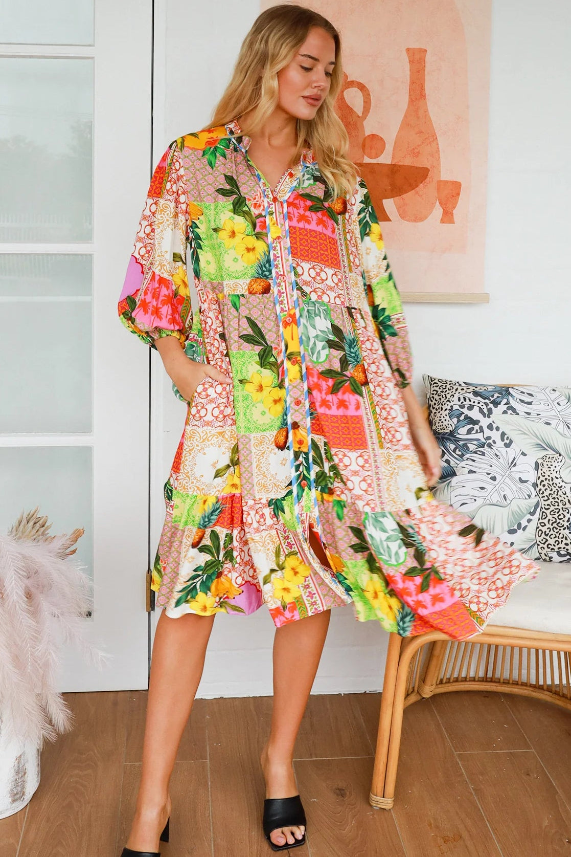 “Woman in a tropical bamboo patchwork boho midi dress with mandarin collar and belt – sustainable bohemian clothing Australia”