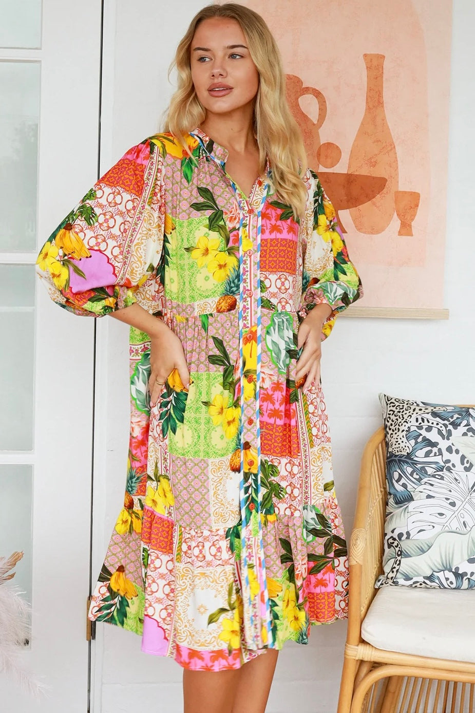 “Woman in a tropical bamboo patchwork boho midi dress with mandarin collar and belt – sustainable bohemian clothing Australia”