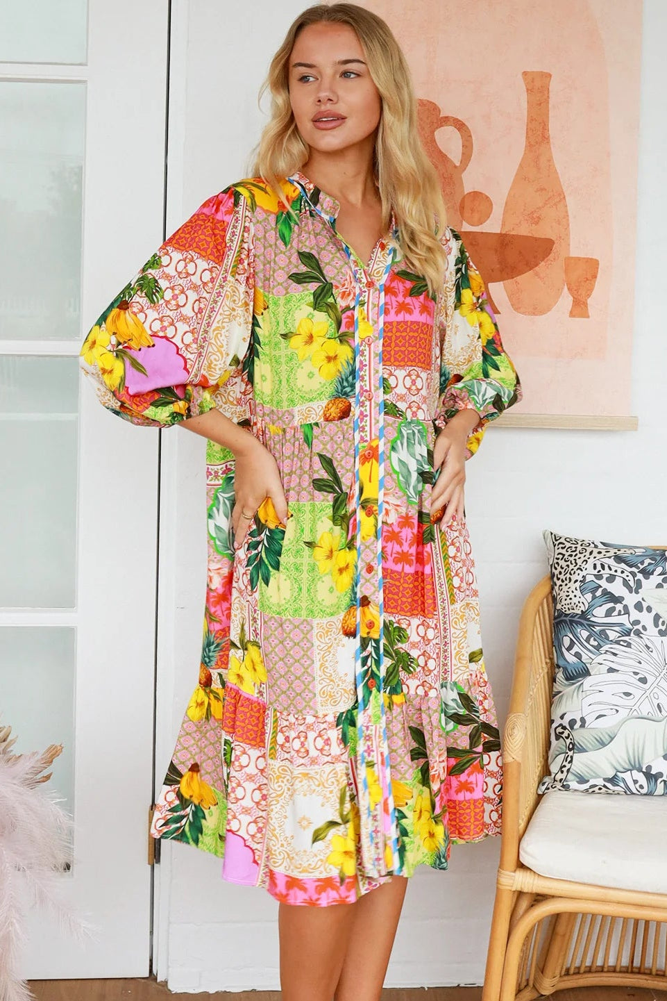 “Woman in a tropical bamboo patchwork boho midi dress with mandarin collar and belt – sustainable bohemian clothing Australia”