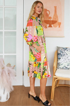 “Woman in a tropical bamboo patchwork boho midi dress with mandarin collar and belt – sustainable bohemian clothing Australia”