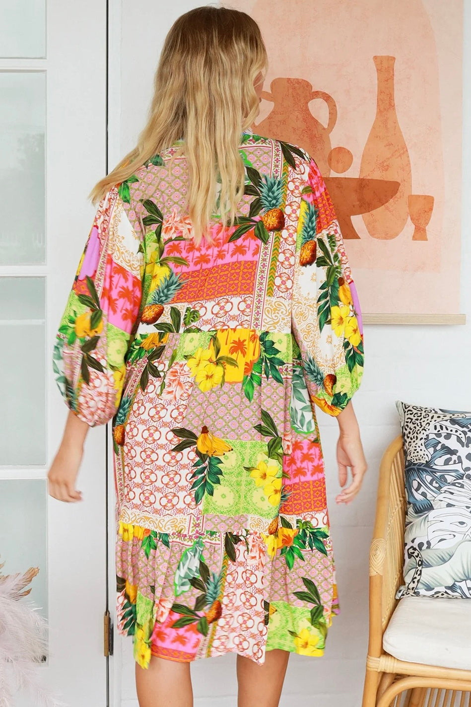 “Woman in a tropical bamboo patchwork boho midi dress with mandarin collar and belt – sustainable bohemian clothing Australia”