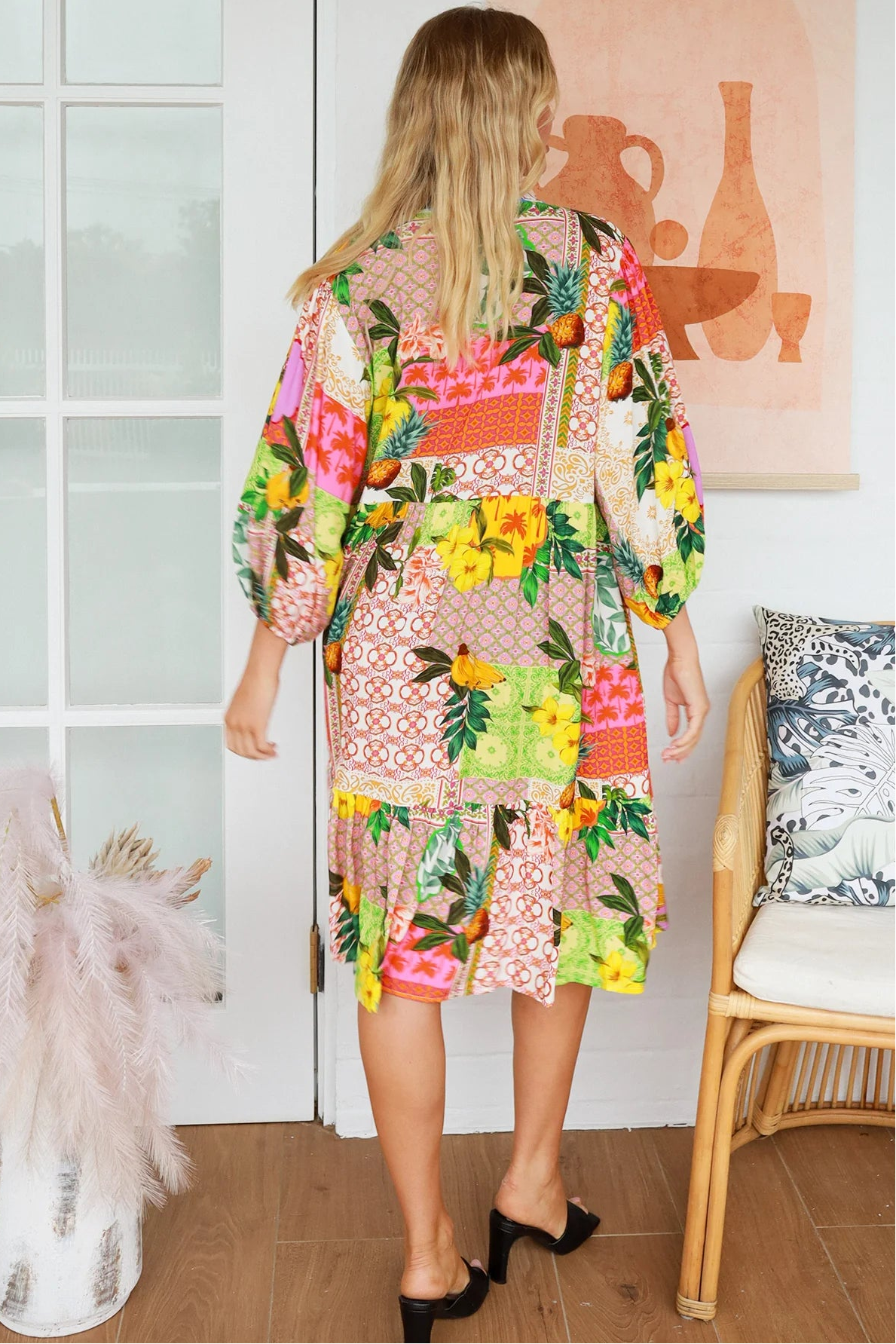 “Woman in a tropical bamboo patchwork boho midi dress with mandarin collar and belt – sustainable bohemian clothing Australia”