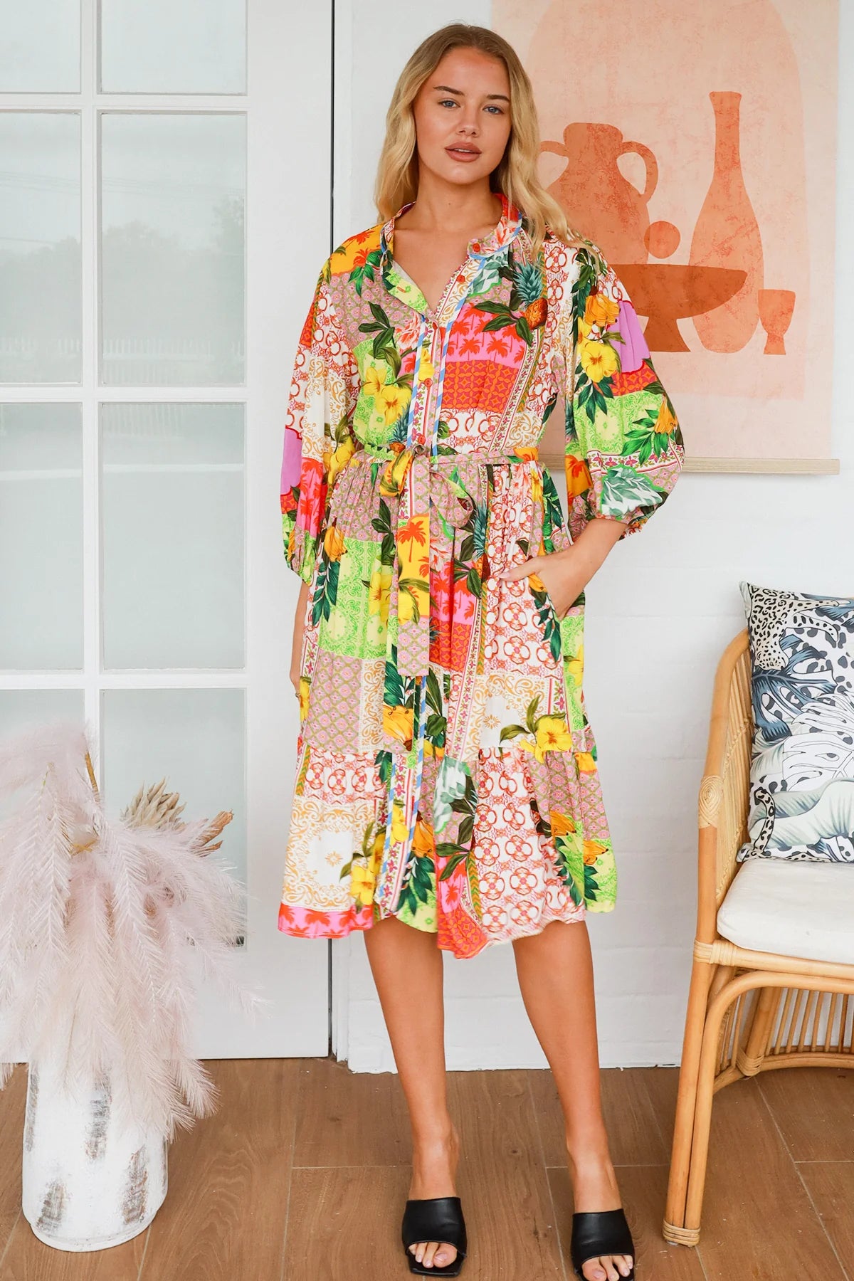 “Woman in a tropical bamboo patchwork boho midi dress with mandarin collar and belt – sustainable bohemian clothing Australia”