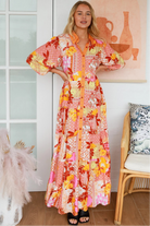 Jacqueline Floral Maxi Dress by Salty Palm in coral pink patchwork floral print with sash, pockets and button-through front