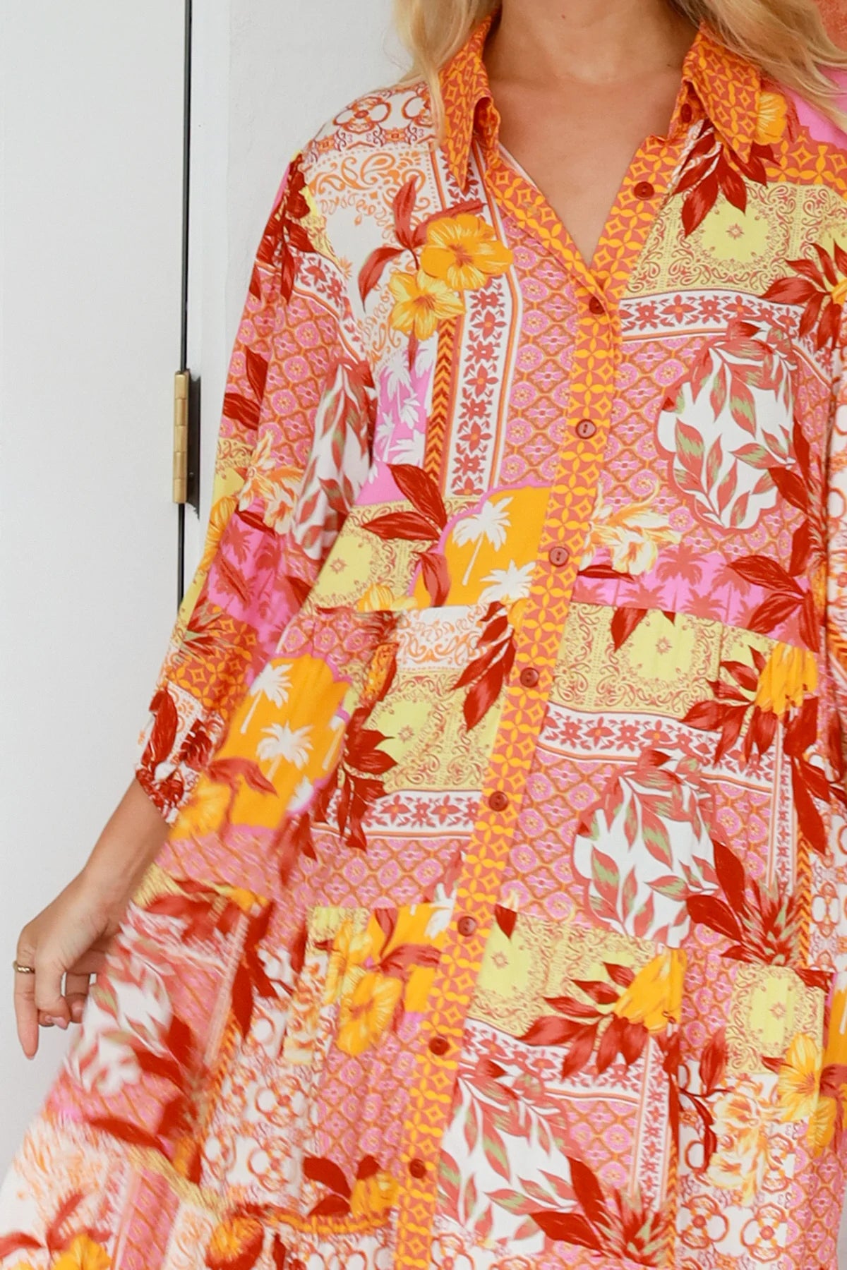 Jacqueline Floral Maxi Dress by Salty Palm in coral pink patchwork floral print with sash, pockets and button-through front