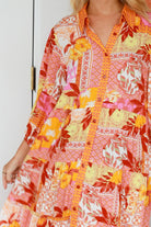Jacqueline Floral Maxi Dress by Salty Palm in coral pink patchwork floral print with sash, pockets and button-through front