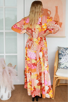 Jacqueline Floral Maxi Dress by Salty Palm in coral pink patchwork floral print with sash, pockets and button-through front