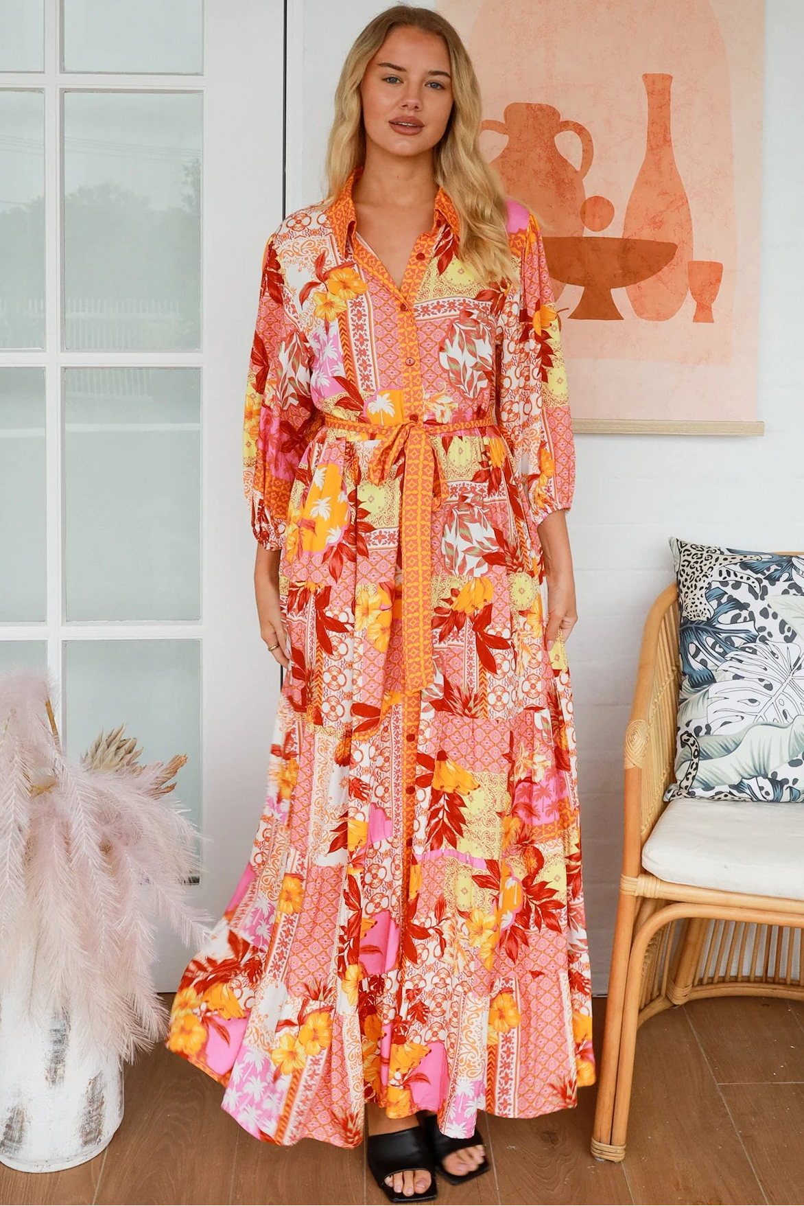 Jacqueline Floral Maxi Dress by Salty Palm in coral pink patchwork floral print with sash, pockets and button-through front