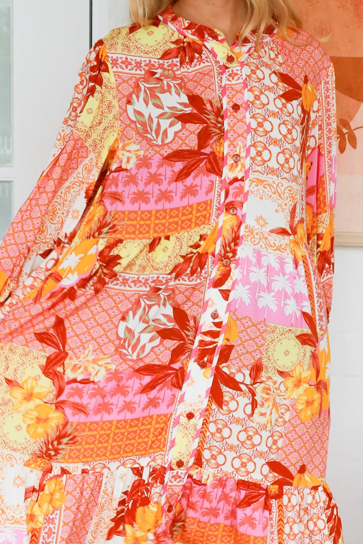 Jacqueline Floral Midi Dress by Salty Palm in coral pink patchwork floral print with split neckline and self-tie sash