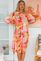 Jacqueline Floral Midi Dress by Salty Palm in coral pink patchwork floral print with split neckline and self-tie sash