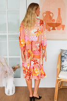 Jacqueline Floral Midi Dress by Salty Palm in coral pink patchwork floral print with split neckline and self-tie sash