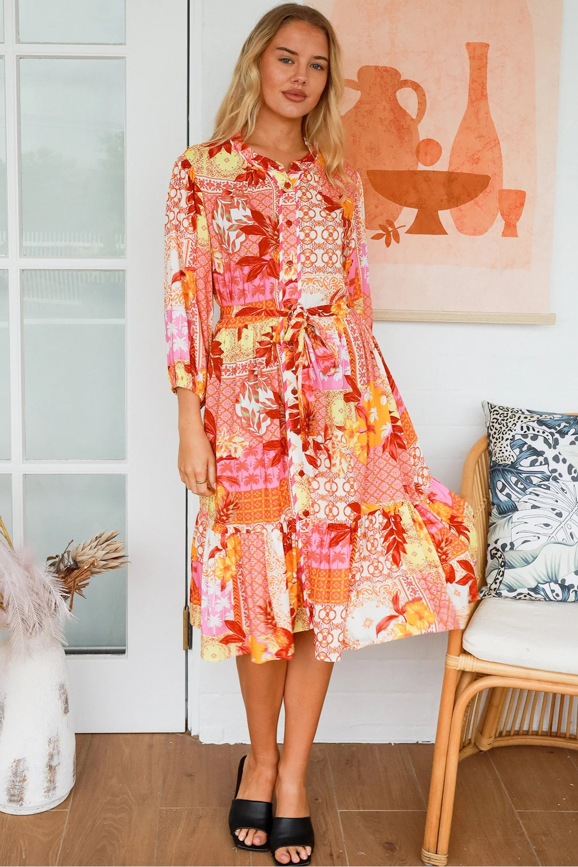 Jacqueline Floral Midi Dress by Salty Palm in coral pink patchwork floral print with split neckline and self-tie sash