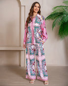 Model wearing pink floral baroque print shirt and wide-leg pants set with long sleeve and contrast piping - boho two-piece outfit Australia.