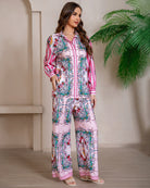 Model wearing pink floral baroque print shirt and wide-leg pants set with long sleeve and contrast piping - boho two-piece outfit Australia.