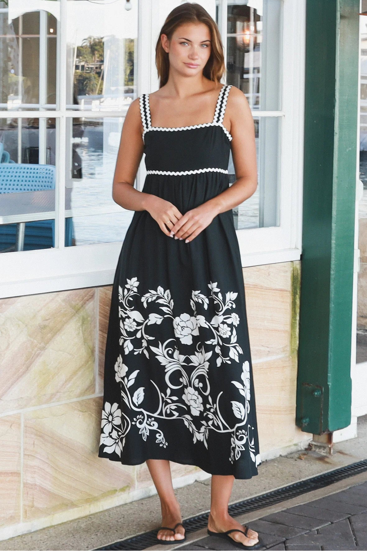 Black and white floral rayon maxi dress with tie-back detail against a black base styled for Australian boho fashion